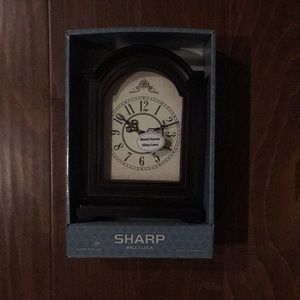 A sharp wall clock ( 6.5 ‘’W 9’’H X 3’’D )